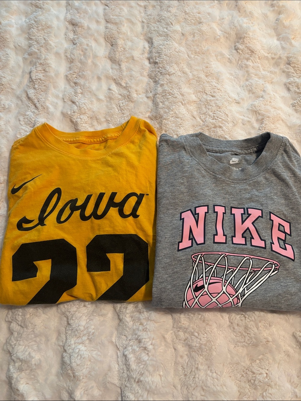 Two Nike Kids basketball tees
